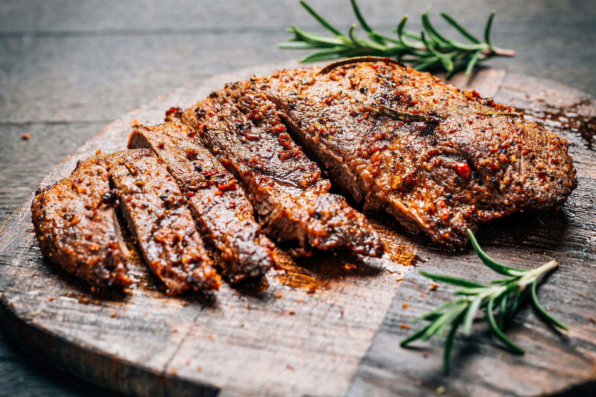 Grilled beef steak with spices on cutting board